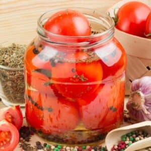 A jar of canned tomatoes.